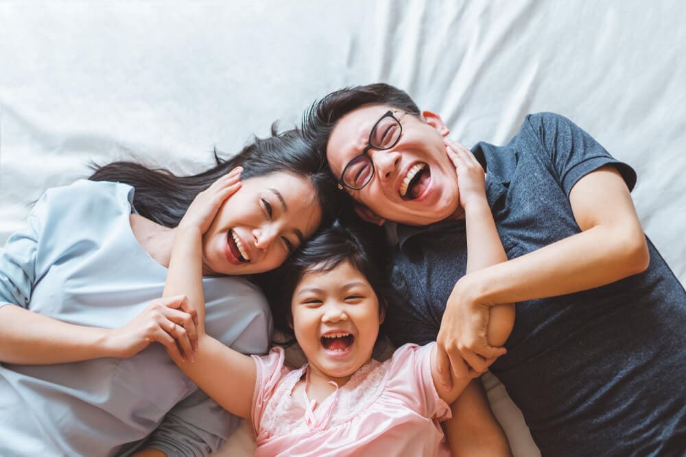 Smiling family embracing outdoors
